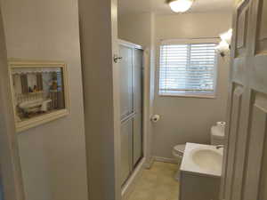 Bathroom with vanity and a stall shower