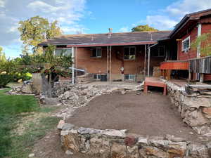 Back of house with a patio