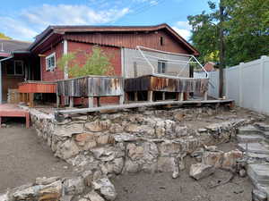 Back of house/garage with garden planters