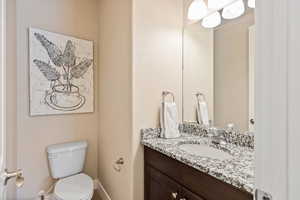 Bathroom featuring vanity and toilet