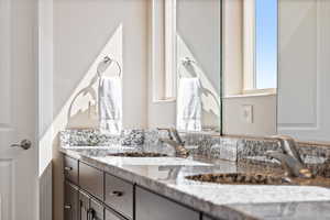 Bathroom featuring double vanity