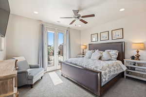 Carpeted bedroom featuring access to outside, a ceiling fan, recessed lighting, and french doors