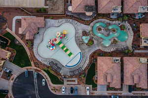 Aerial view of residential area featuring a pool area
