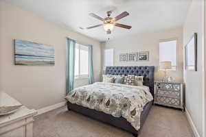 Bedroom featuring carpet flooring and ceiling fan