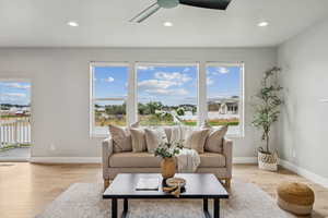 Living area featuring recessed lighting, light wood-style floors, and ceiling fan