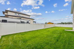 View of fenced backyard