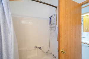 Bathroom featuring shower / tub combo