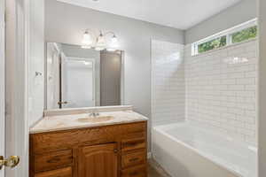 Full bathroom featuring vanity and  shower combination