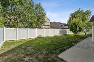 Fenced backyard with a residential view