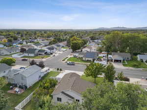 Aerial perspective of suburban area with a mountainous background