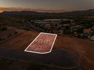 Aerial view of property's location featuring property boundaries highlighted and a mountain backdrop