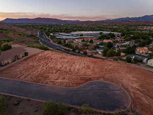 Aerial perspective of suburban area with a mountainous background