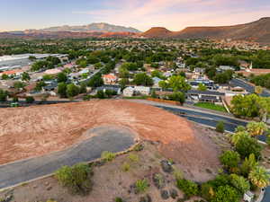 Aerial perspective of suburban area with a mountain backdrop