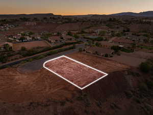 Aerial view at dusk of property boundaries highlighted and a mountain view