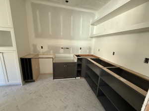 Pantry featuring a sink