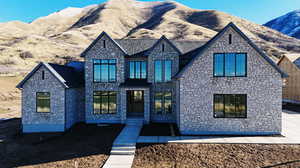 View of front of house with stone siding