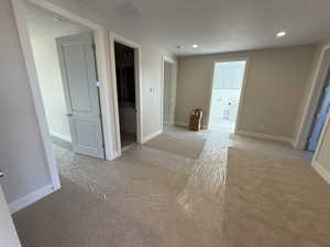 View of Loft featuring recessed lighting