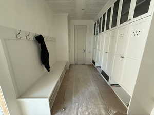 Mudroom with a textured ceiling