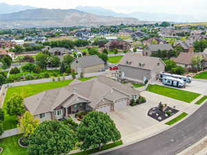 Aerial perspective of suburban area featuring a mountain backdrop
