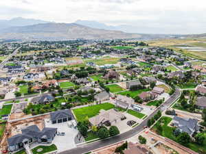 Aerial overview of property's location featuring nearby suburban area and a mountainous background