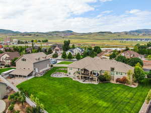 Aerial view of residential area featuring a mountainous background