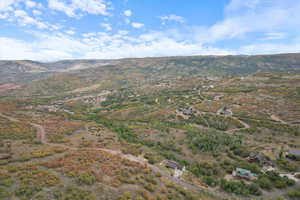 Aerial view of property's location featuring mountains