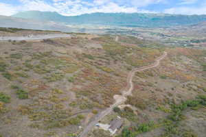 Aerial overview of property's location with a mountainous background