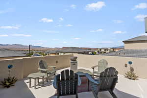 View of patio / terrace featuring a residential view and a mountain view