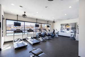 Exercise room with a textured ceiling and recessed lighting