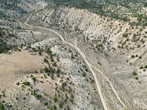Aerial view of property and surrounding area featuring rural landscape and a desert landscape
