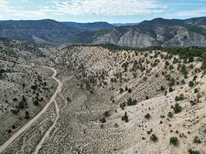 Overview of rural landscape with a mountain backdrop and a desert landscape