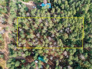 Aerial view of property and surrounding area with property boundaries highlighted