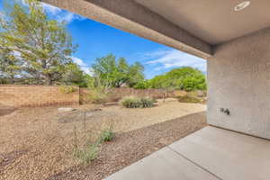 Fenced backyard featuring a patio area