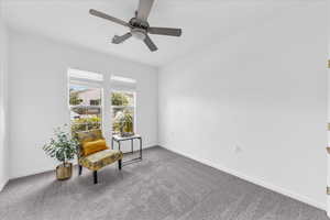 Sitting room with carpet flooring and ceiling fan