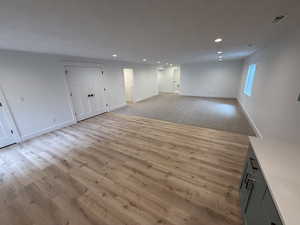 Unfurnished living room with recessed lighting and light wood-style floors