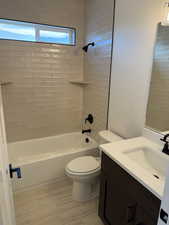 Bathroom with shower / washtub combination and vanity
