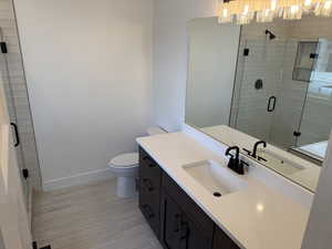 Bathroom with vanity and a stall shower