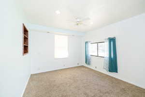 Unfurnished room featuring carpet flooring, ceiling fan, and recessed lighting