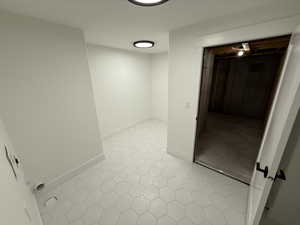 Hall featuring baseboards