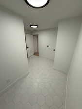 Hall featuring baseboards