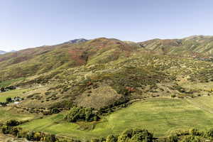 View of mountain backdrop featuring rural landscape