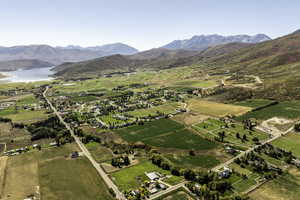 Aerial view of sparsely populated area with a water and mountain view