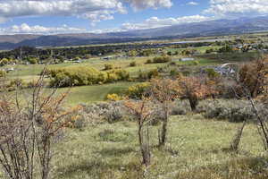 View of mountain background featuring rural landscape