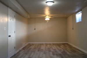 Empty room with light wood-type flooring and baseboards