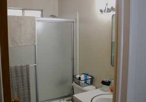 Full bathroom with vanity and shower / bath combination with glass door