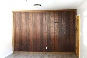 Detailed view of wood finished floors and wood walls