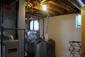 Laundry room with independent washer and dryer and heating unit