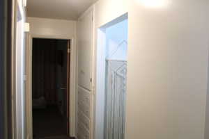 View of hallway with built in linnen closet.