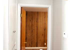 Detailed view of wood walls and built in linen cabinets
