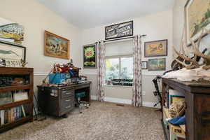 Bedroom 3 with light colored carpet and baseboards